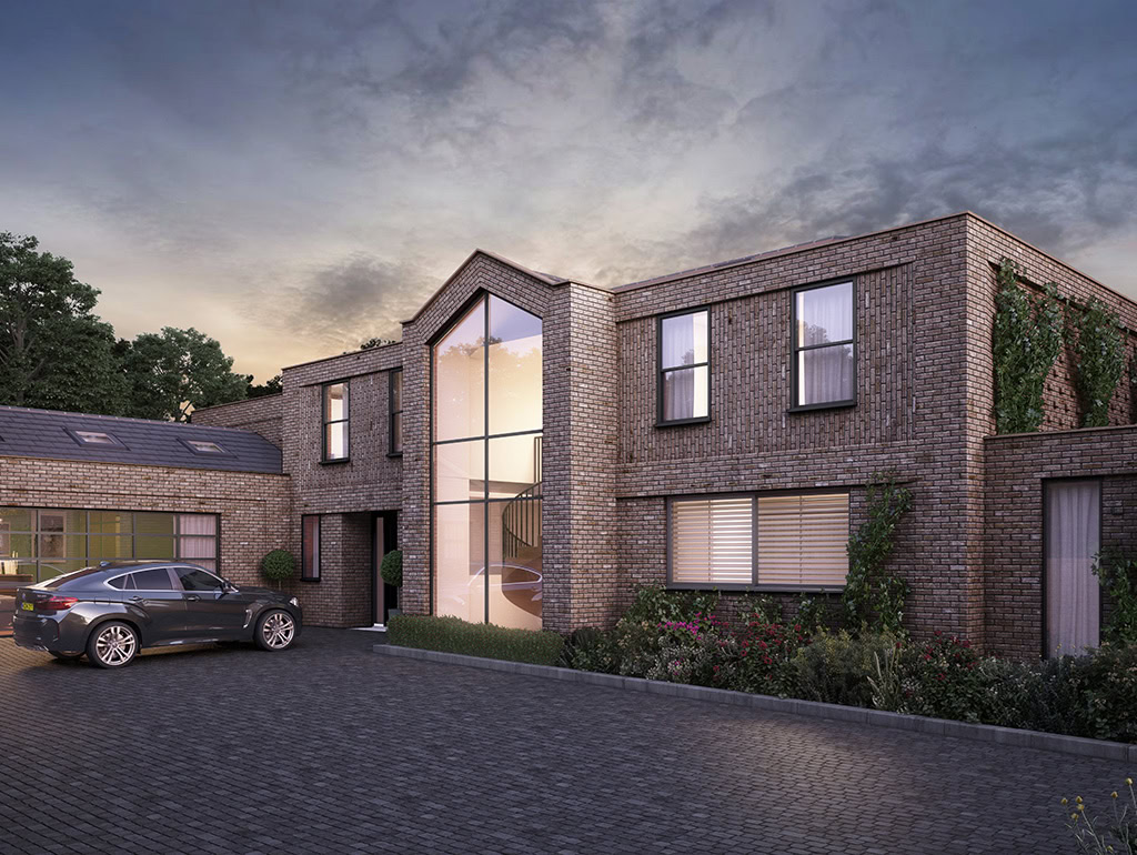 Exterior of large property with a large windowed front. House is shown at dusk, light coming from inside and slight reflections on windows.